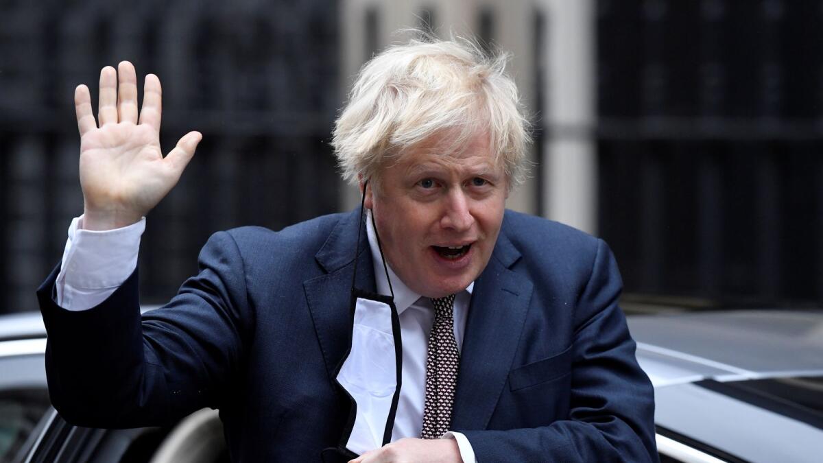 Britain's Prime Minister Boris Johnson seen in public for the first time since his self-isolation ended, arrives at Downing Street during the coronavirus disease outbreak in London, Britain, on Thursday.