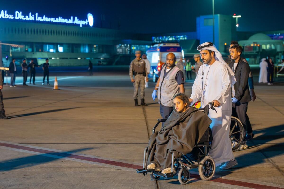 Mesk wheeled into an ambulance at the Abu Dhabi airport. Photo: Shihab