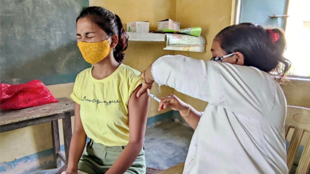 A medic inoculates Covid-19 vaccine at a vaccination centre in India. — ANI