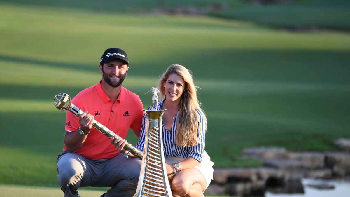 Jon Rahm (left) of Spain celebrates with his wife after winning the Dubai DP World Tour Championship on November 24, 2019. (AFP file)