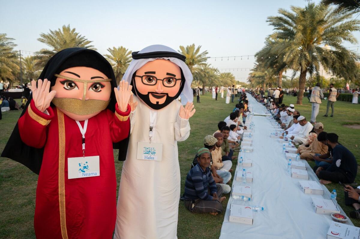 Faithful attend the iftar at Al Safia park, Ajman on Thursday. March 28, 2024. KT Photos:  Shihab