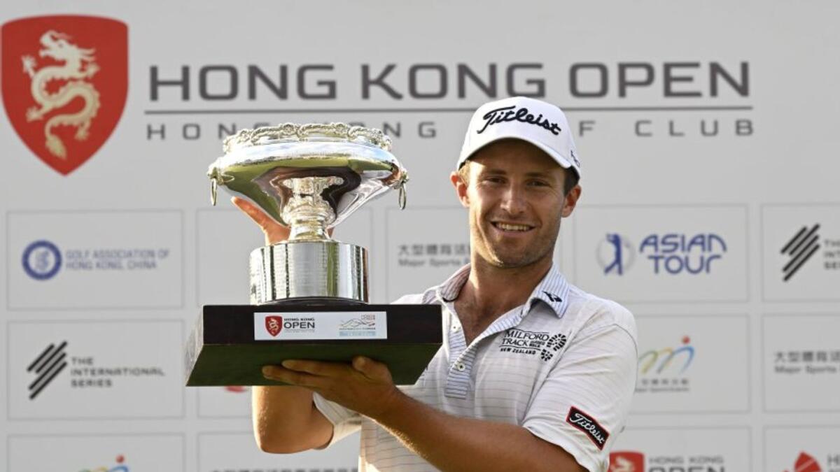 Ben Campbell lifts the trophy after winning the $2 million Hong Kong Open. - Supplied photo