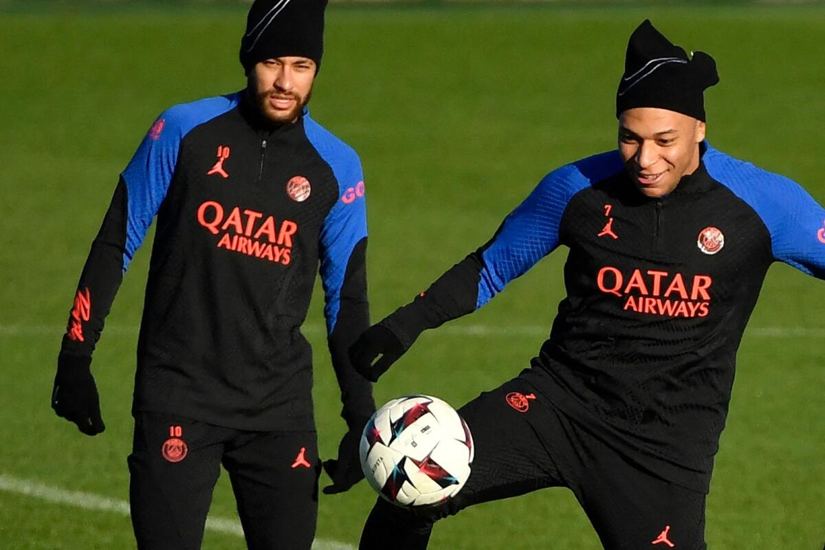 PSG's Brazilian forward Neymar (left) and French forward Kylian Mbappe (right) take part in a training session on Tuesday. — AFP