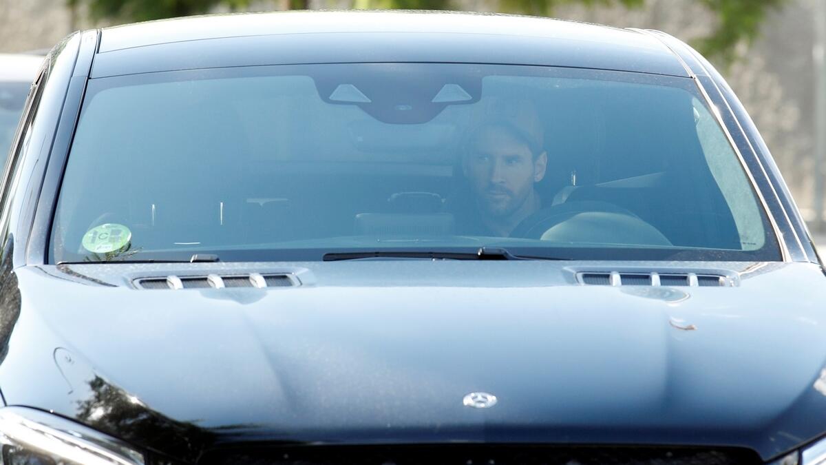 Barcelona's Lionel Messi arrives for training