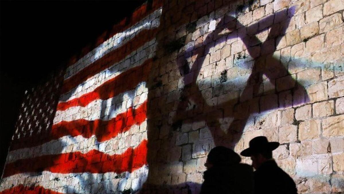 Israeli and US flags are projected onto the ramparts of Jerusalem’s Old City, February 11, 2020.