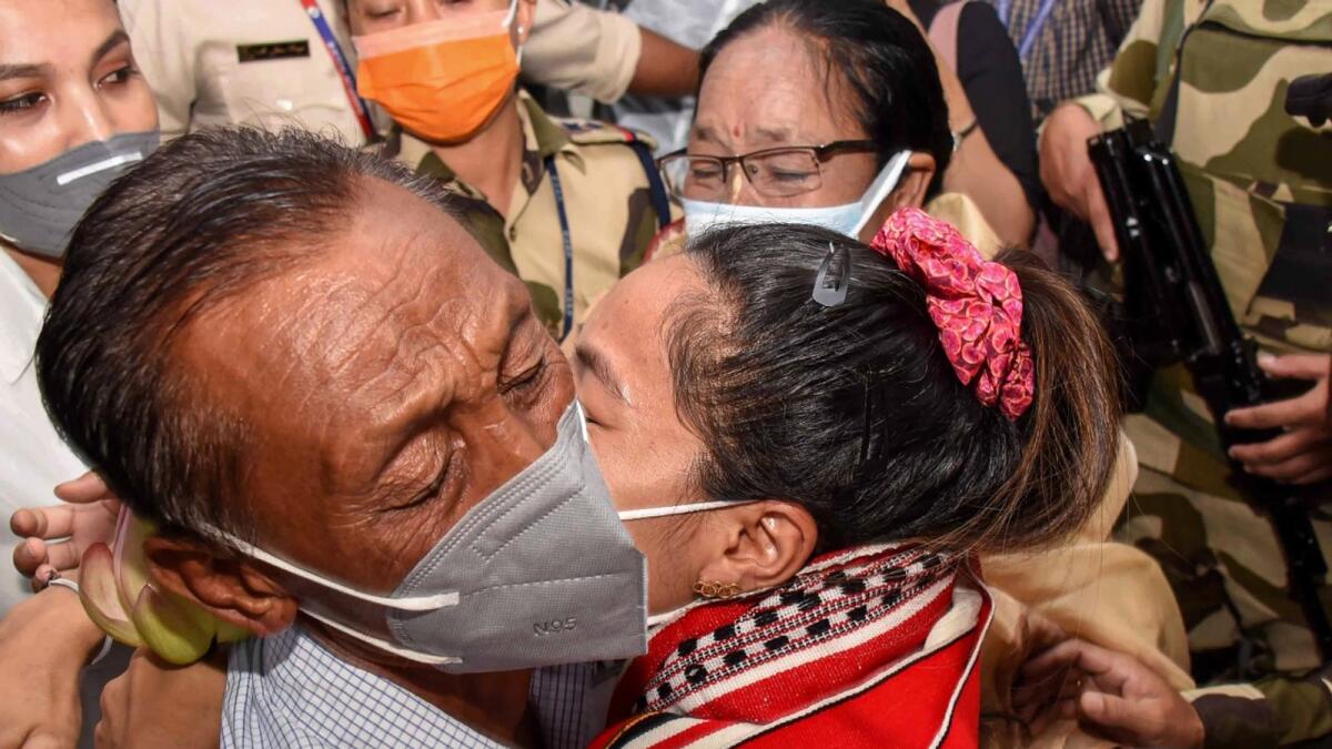 Saikhom Mirabai Chanu hugs her father after arriving in Imphal, Manipur. (PTI)