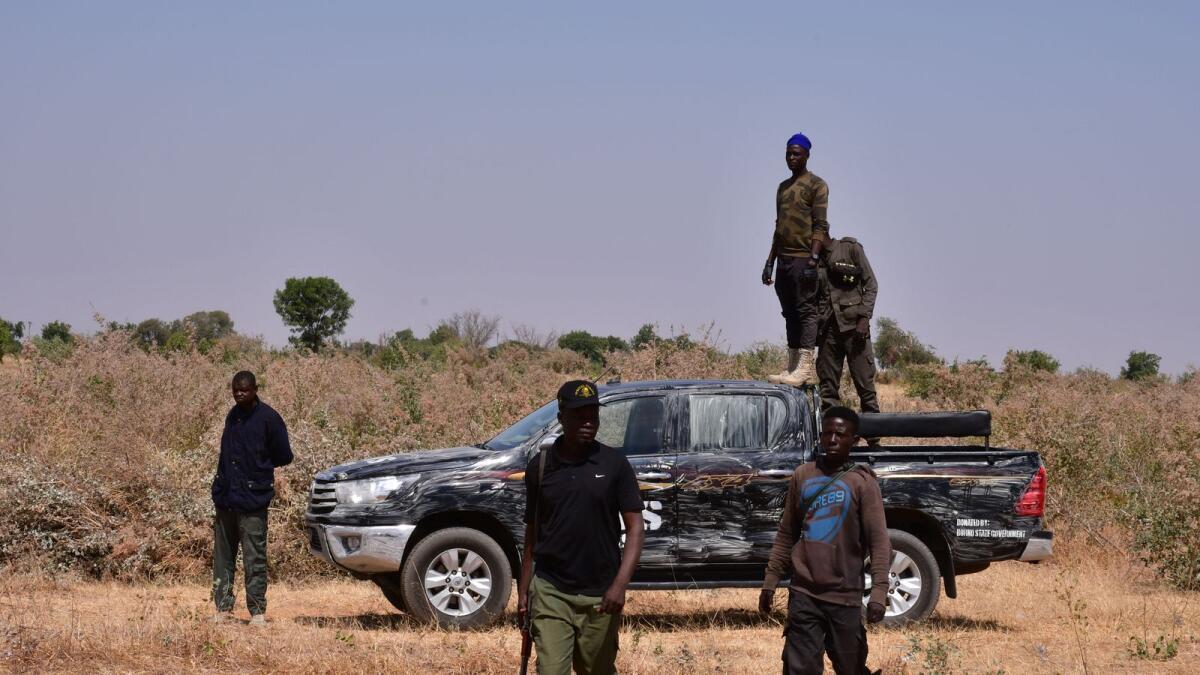 Nigerian security forces are seen on the site of a sabotage attack. Photo: AFP