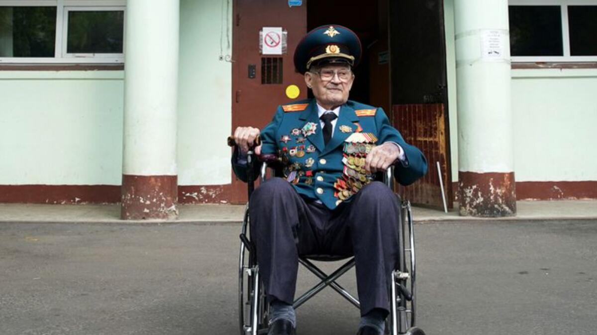 World War Two veteran Nikolay Bagayev leaves a hospital in Korolyov, Moscow after being treated for Covid. Photo: Reuters