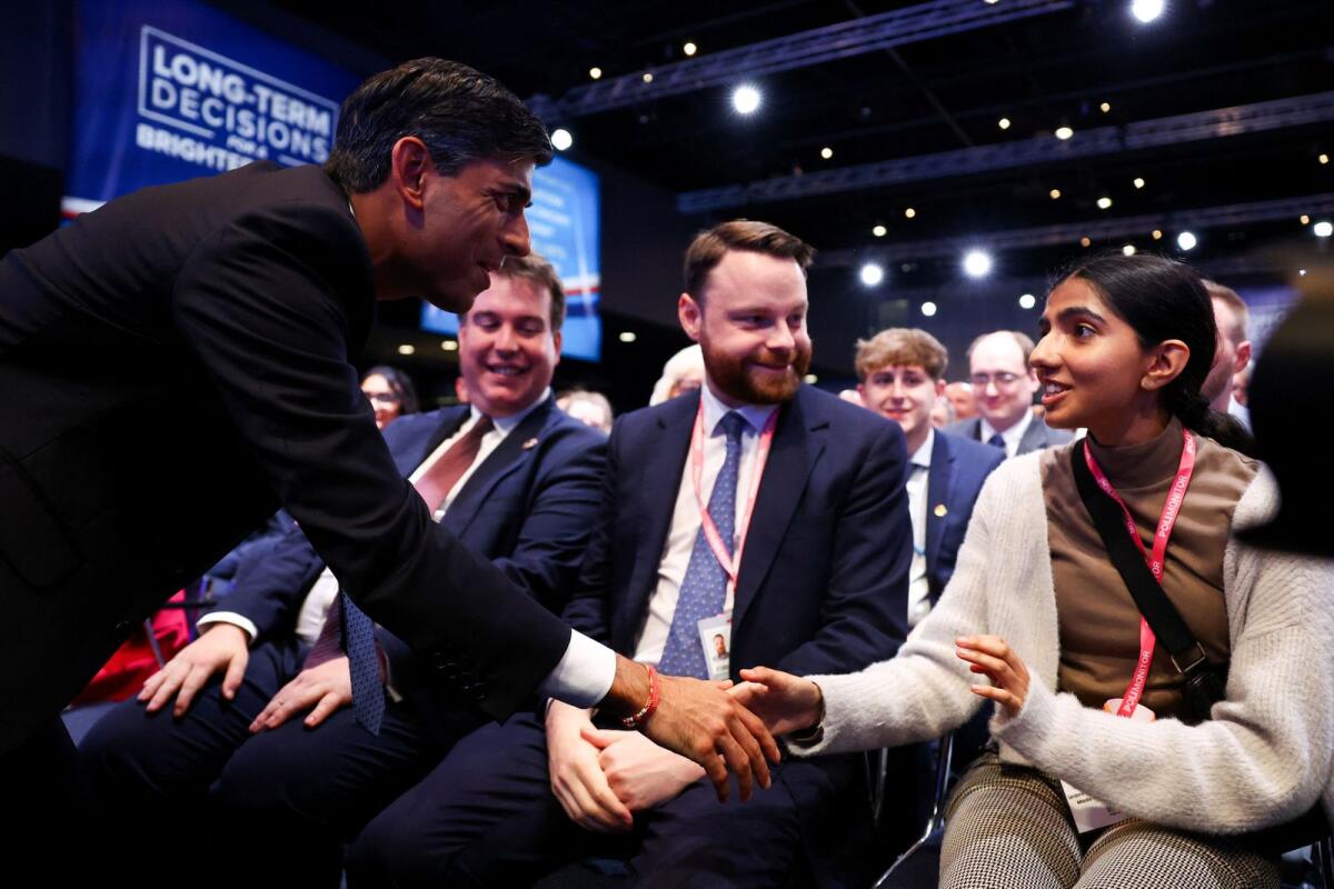 Britain's Prime Minister Rishi Sunak is greeted as he attends Britain's Conservative Party's annual conference in Manchester, Britain, on October 2, 2023. — Reuters