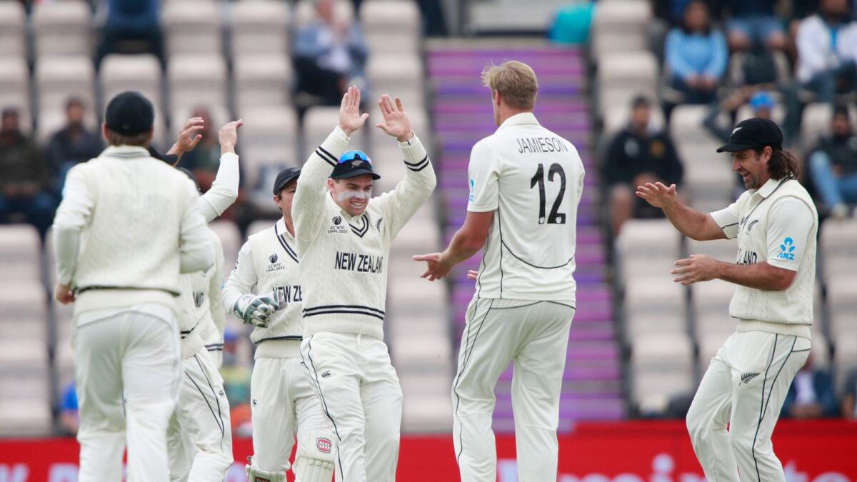 New Zealand's Kyle Jamieson (second right) celebrates with teammates the dismissal of India's captain Virat Kohli during the third day of the World Test Championship final. — AP