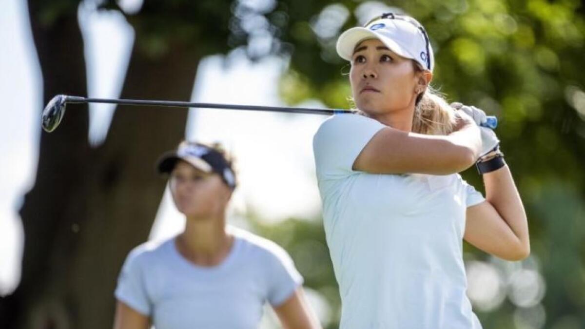 Danielle Kang of the United States hits a tee shot on the 18th hold during the first round of the LPGA Drive Championship golf tournament at Inverness Club. (Reuters)