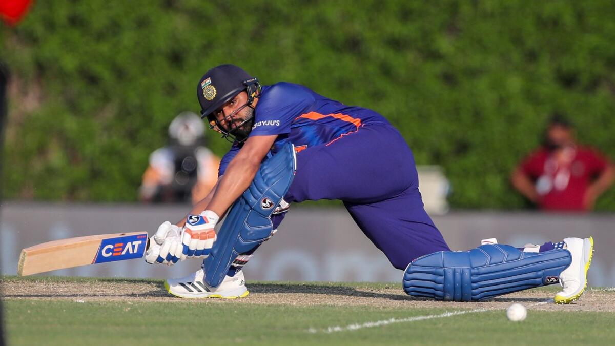 India's Rohit Sharma plays a sweep shot during the warm-up match against Australia in Dubai on Wednesday. (AP)
