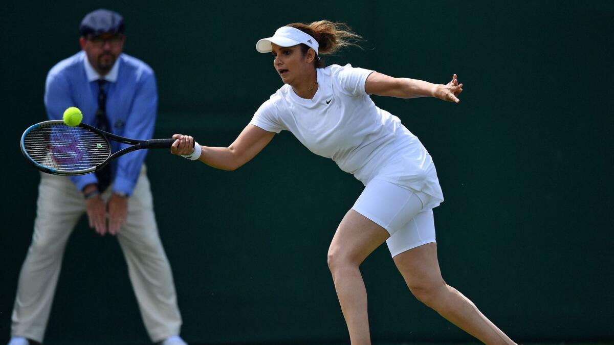 India's Sania Mirza plays a forehand return during the doubles first round match. (AFP)