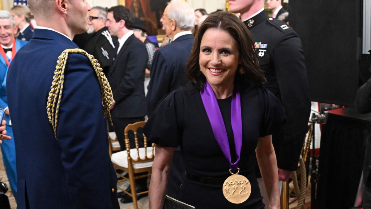 Julia Louis-Dreyfus smiles after being awarded with the 2021 National Medal of Arts