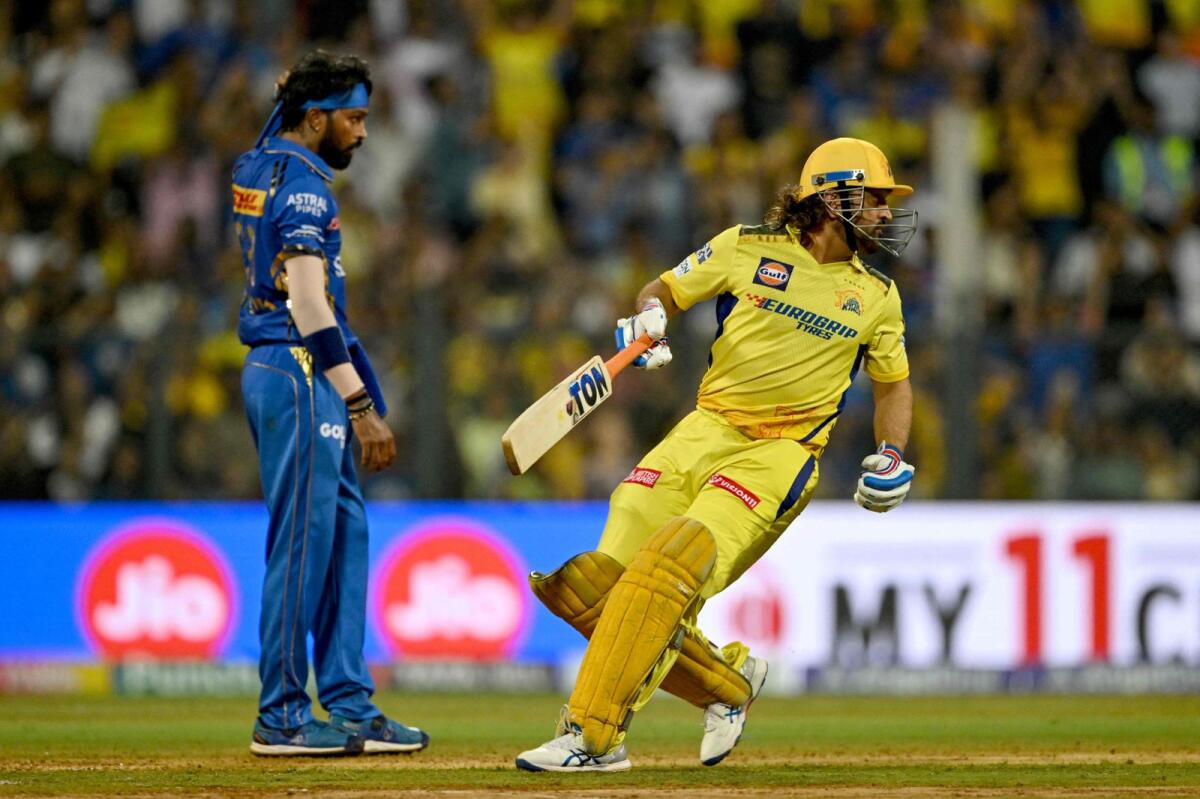 MS Dhoni (right) hit three sixes against Hardik Pandya in the final over of the Chennai Super Kings innings. — AFP