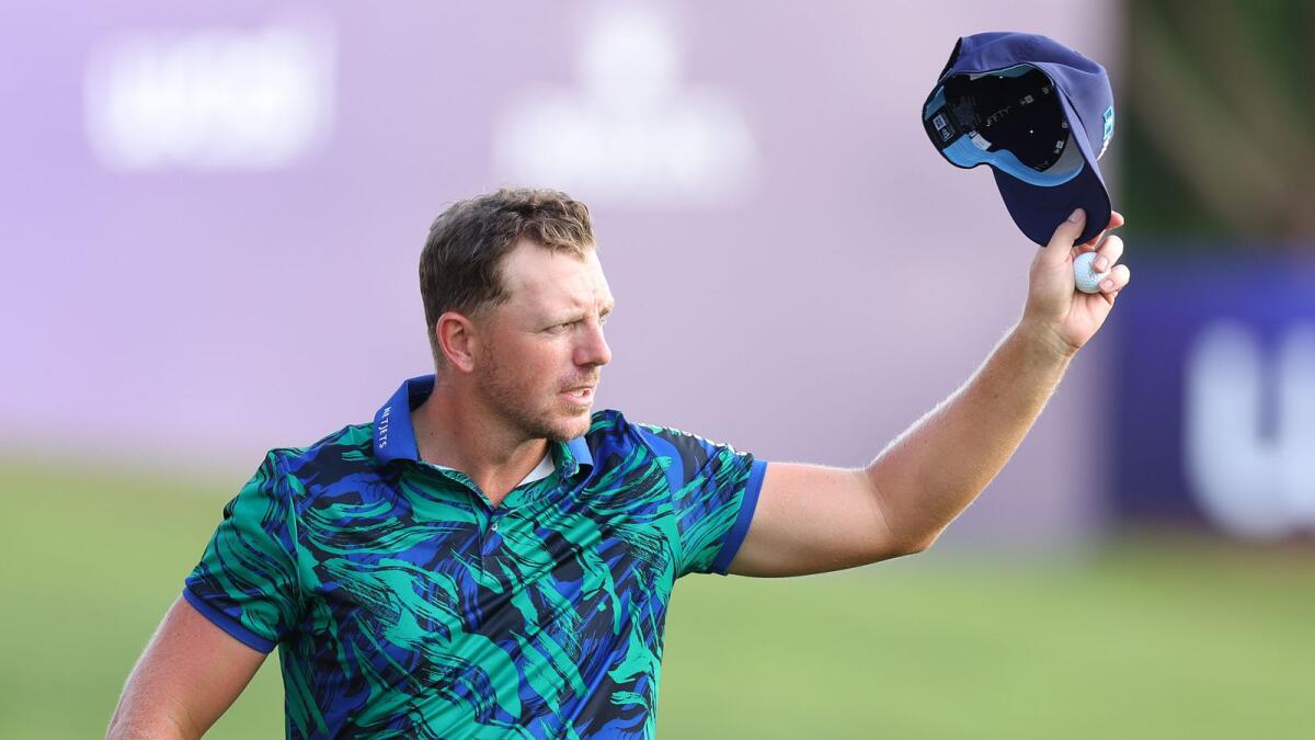 Matt Wallace acknowledges the ceers from fans after his astonish round of 12-under par 60 on day three at the DP World Tour Championship. - Supplied photo