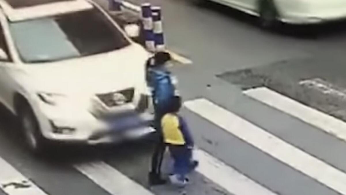 china, viral video, boy scolds driver, mother hit