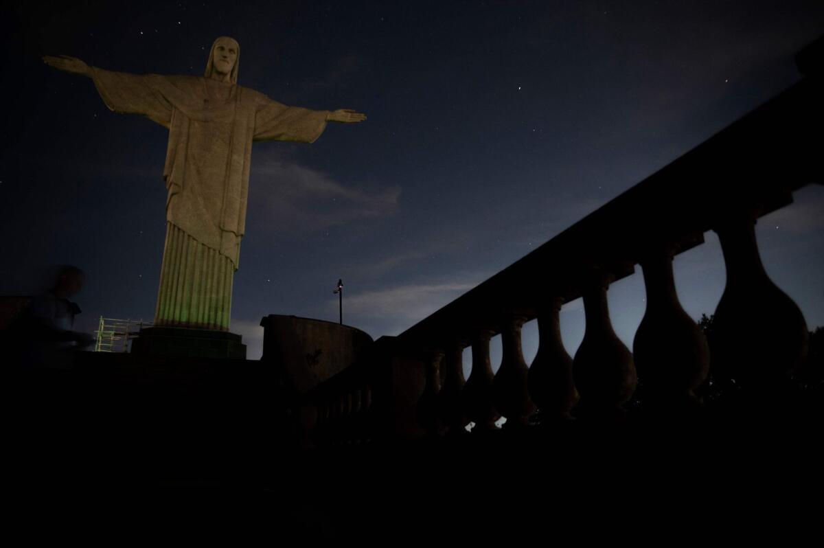 The Christ the Redeemer statue is seen without illumination to condemn racist acts against Brazilian footballer Vinicius Junior in Rio de Janeiro, Brazil. — AFP