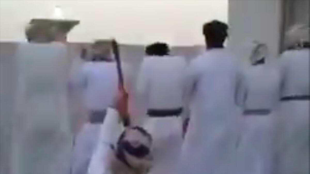 Video: Man fires gun behind praying men in Oman, arrested