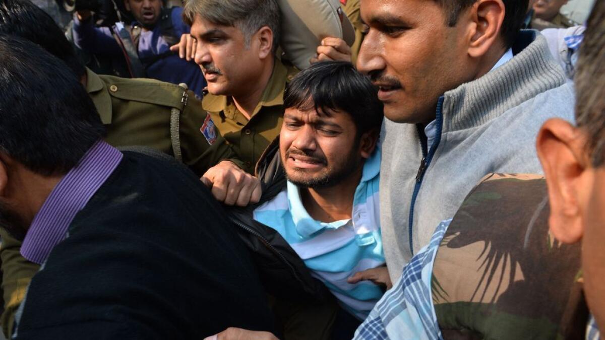 Indian student union leader Kanhaiya Kumar (C) is escorted by police into Patiala Court for a hearing in New Delhi. 