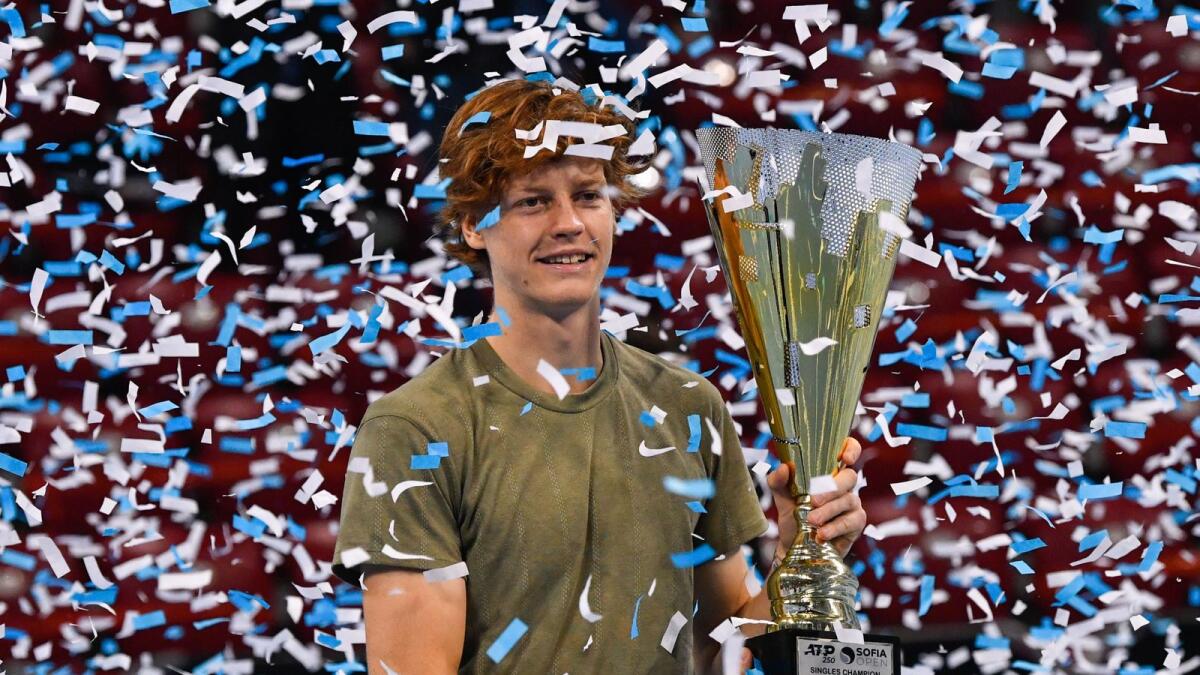 Italian tennis player Jannik Sinner celebrates with the trophy after winning the final against his Canadian opponent at the ATP 250 Sofia Open tennis tournament. — AFP