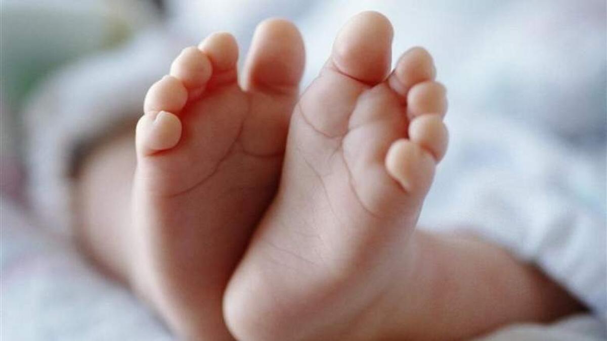 6-month-old struggles to live after  mother flings baby into fire