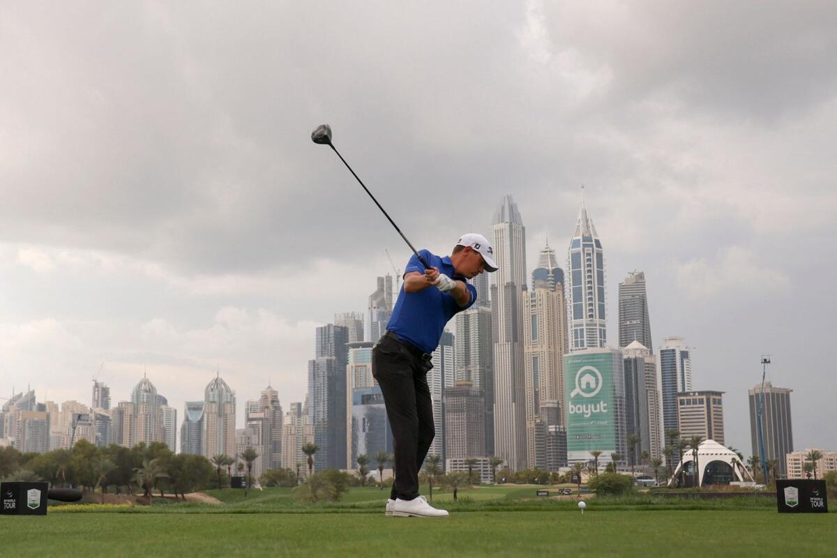 Jason Scrivener of Australia plays a shot during the Dubai Desert Classic. — AFP