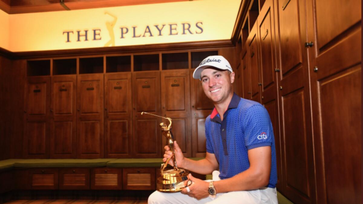 Justin Thomas poses with the trophy. (PGA Tour Twitter)