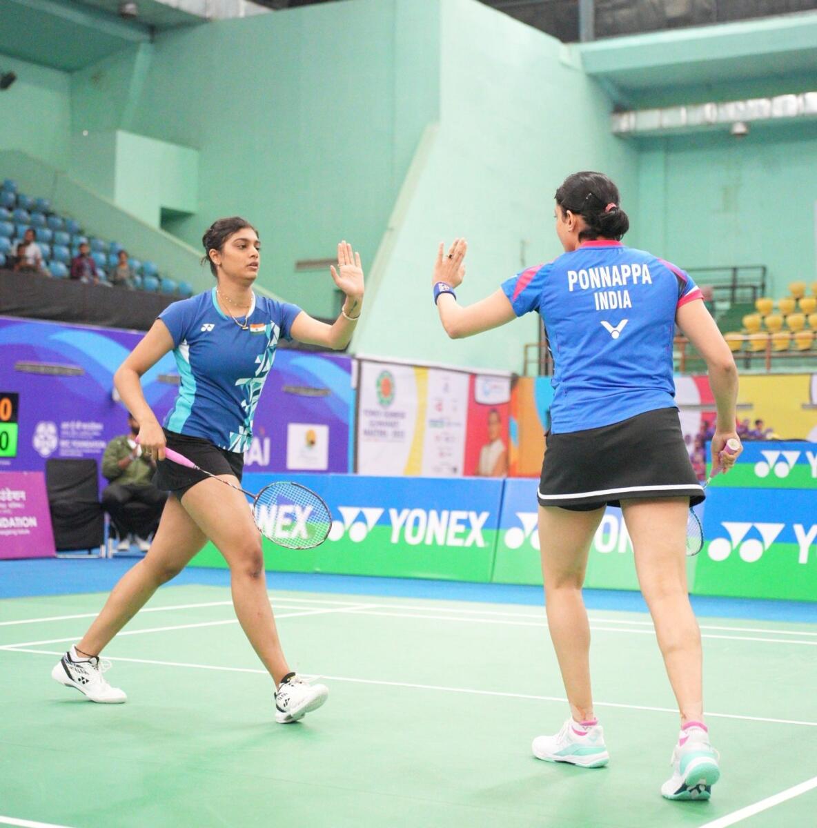 Tanisha Crasto and Ashwini Ponnappa celebrate a point during the women's doubles final in Guwahati on Sunday.  — Badminton Federation of India