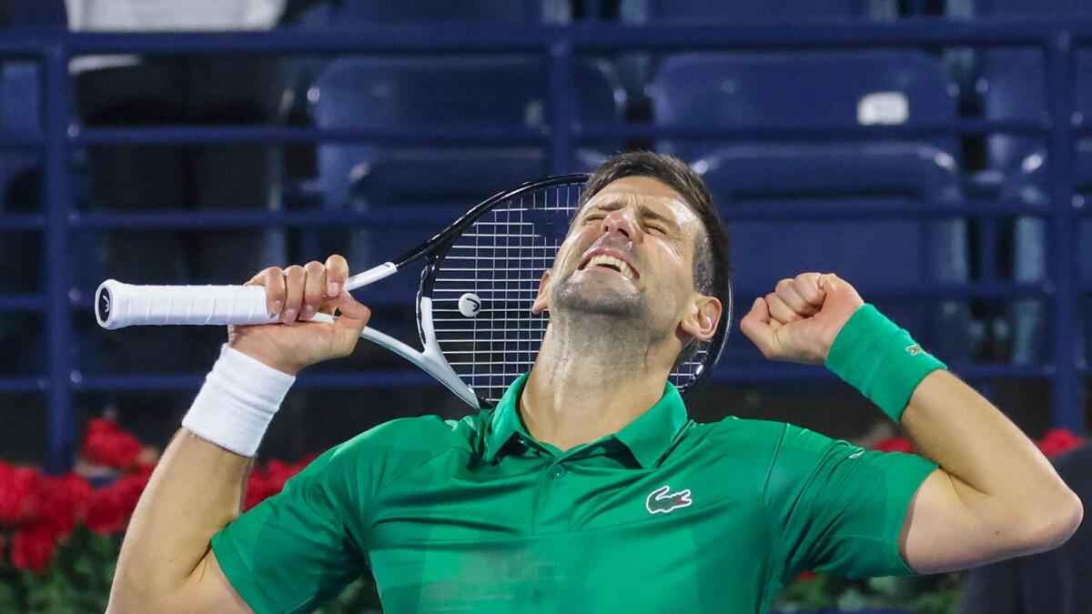 Novak Djokovic of Serbia celebrates after winning the ATP Dubai Duty Free Tennis Championships match against Lorenzo Musetti of Italy. (AFP)