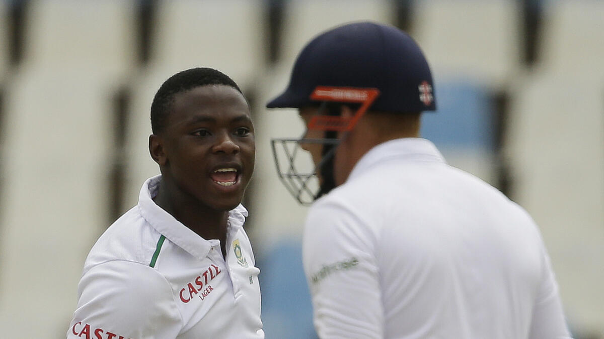 South Africa?s bowler Kagiso Rabada, left, celebrates after dismissing England?s batsman Jonathan Bairstow, right, for 14 runs on the firth day of the fourth test cricket match between South Africa and England, at Centurion Park in Pretoria, South Africa, Tuesday, Jan. 26, 2016. (AP Photo/Themba Hadebe)