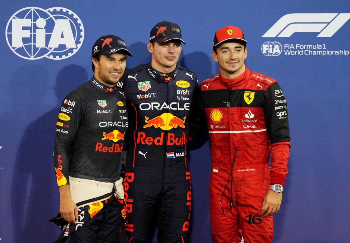 Red Bull's Max Verstappen (centre) with teammate Sergio Perez (left) and Ferrari's Charles Leclerc in Abu Dhabi on Saturday. — Reuters