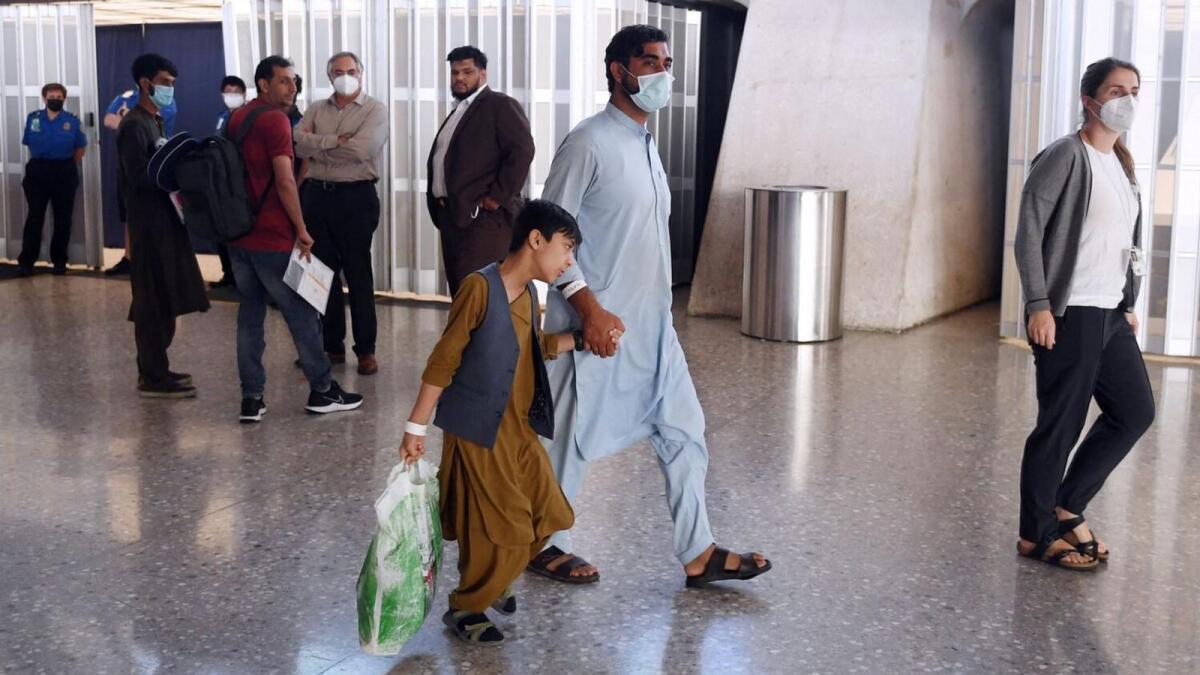 Afghan evacuees reach Washington DC airport. — AFP file