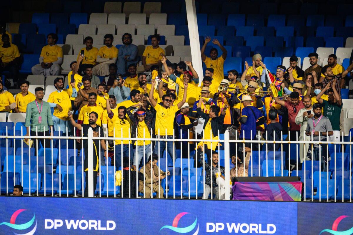 Spectators during the opening match at Sharjah Cricket Stadium