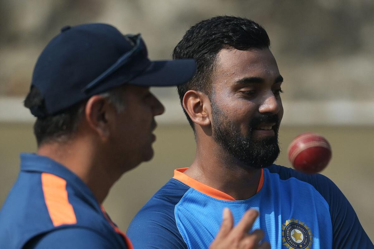 India's KL Rahul (right) speaks with coach Rahul Dravid during a practice session. — AFP