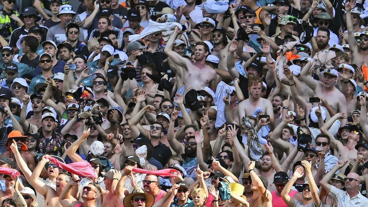 New Zealand fans cheers on their team even as New Zealand lose to Australia on the fourth day of the second cricket Test match at the MCG in Melbourne on Sunday. (AFP)