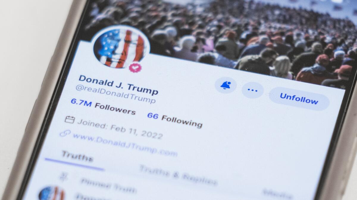 The Truth Social account for former President Donald Trump is seen on a mobile device. — AP