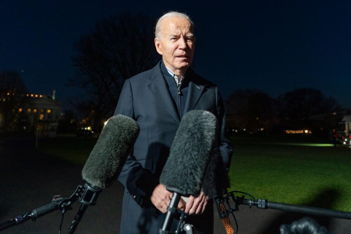 President Joe Biden answers a reporter's question as he walks from Marine One upon arrival on the South Lawn of the White House on December 20, 2023 in Washington. — AP file