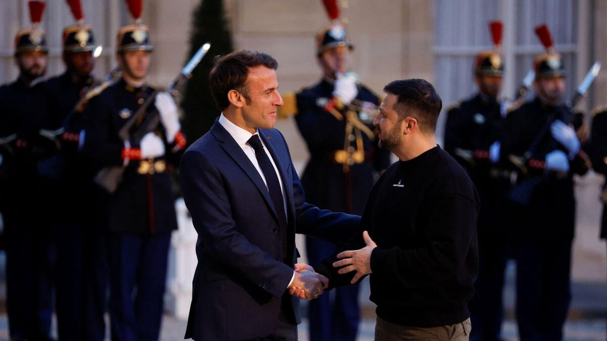 French President Emmanuel Macron welcomes Ukraine's President Volodymyr Zelenskiy at the Elysee Palace in Paris. — Reuters