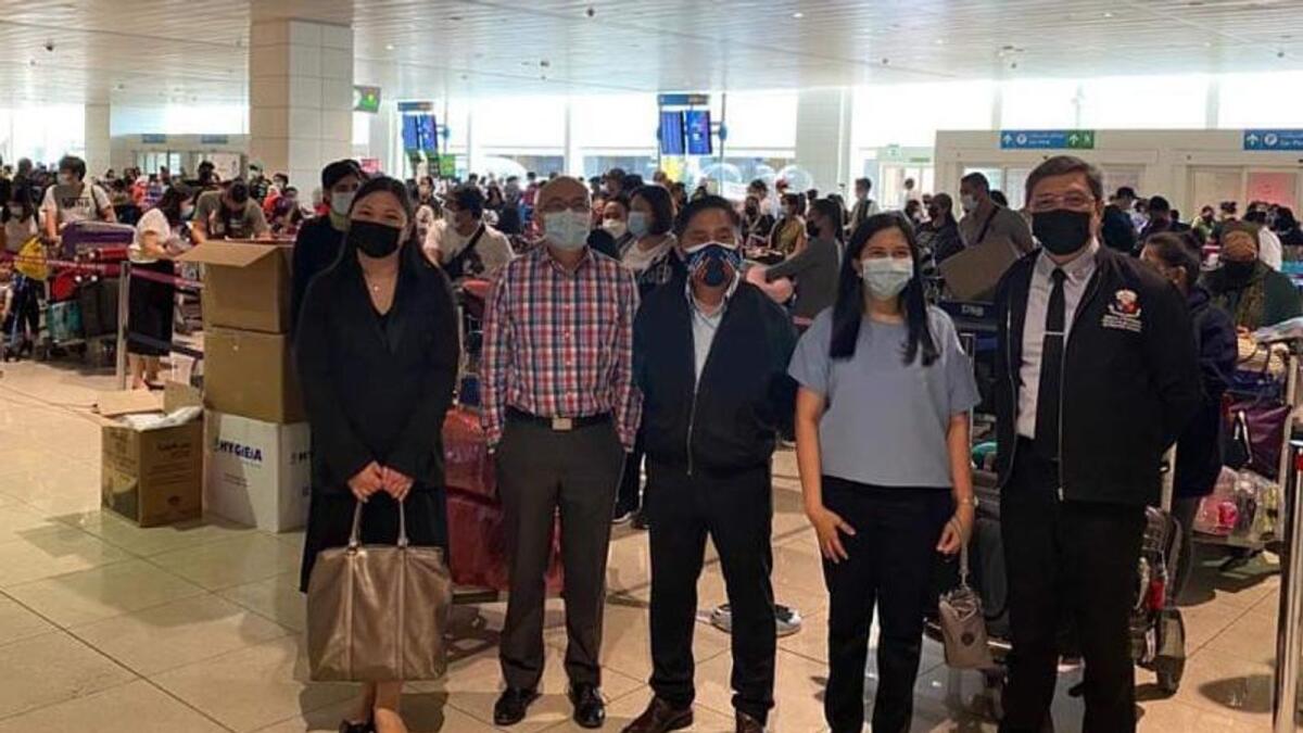 (From left to right) Consul Maria Cynthia P. Pelayo; Deputy Consul General Renato N. Dueñas Jr.; Consul-General Paul Raymund P. Cortes, Vice-Consul Elizabeth P. Ramos, and Labour Attaché Atty. Manuel M. Dimaano oversee the repatriation of 347 OFWs at Terminal 3 of the Dubai International Airport on Tuesday.