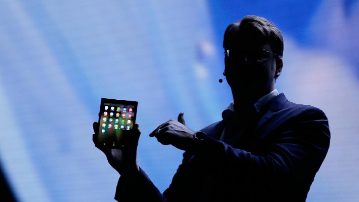 Justin Denison, SVP of Mobile Product Development, talks about the Infinity Flex Display of a folding smartphone during the keynote address of the Samsung Developer Conference, Wednesday, Nov. 7, 2018, in San Francisco.