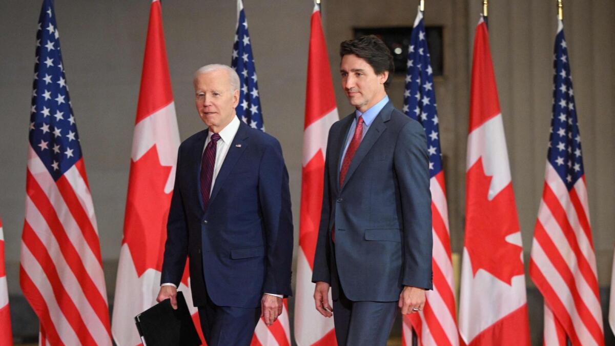 US President Joe Biden and Canada's Prime Minister Justin Trudeau arrive to speak at a joint press conference at the Sir John A. Macdonald Building in Ottawa, Canada. — AFP