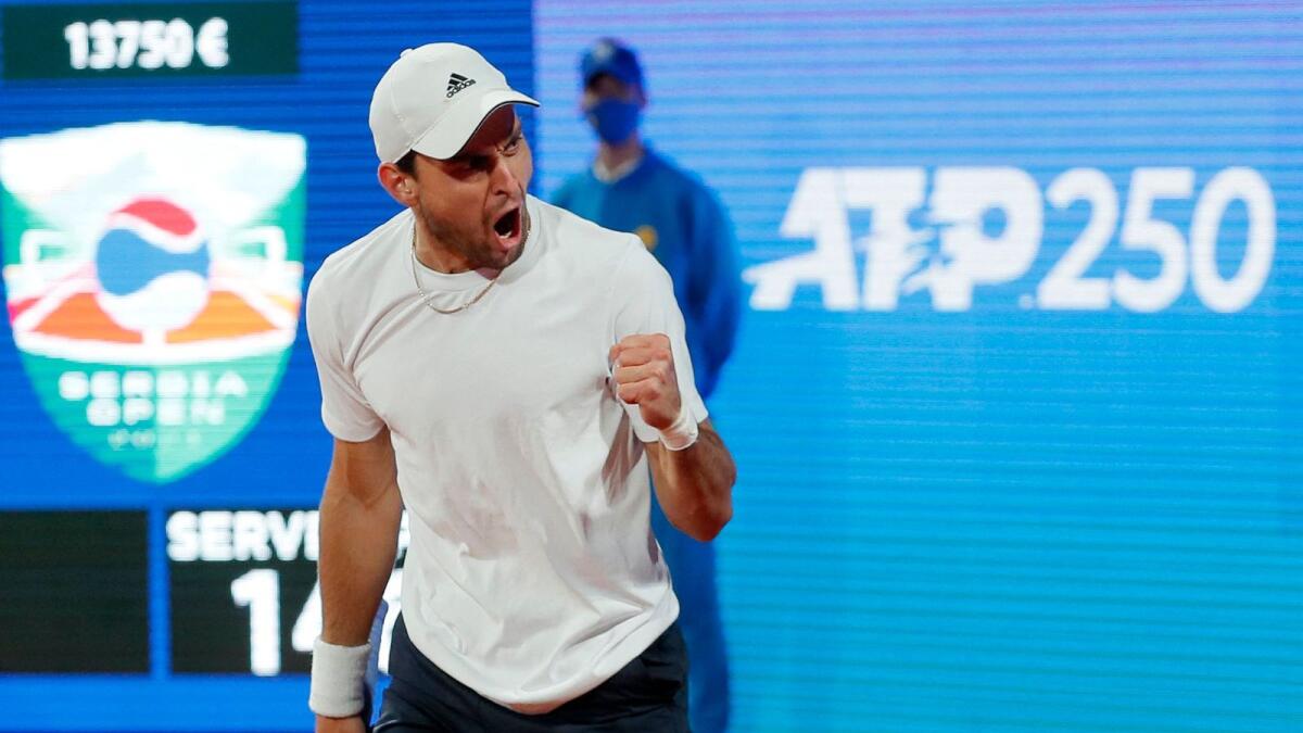 Russia's Aslan Karatsev celebrates after victory over Serbia's Novak Djokovic. — AFP