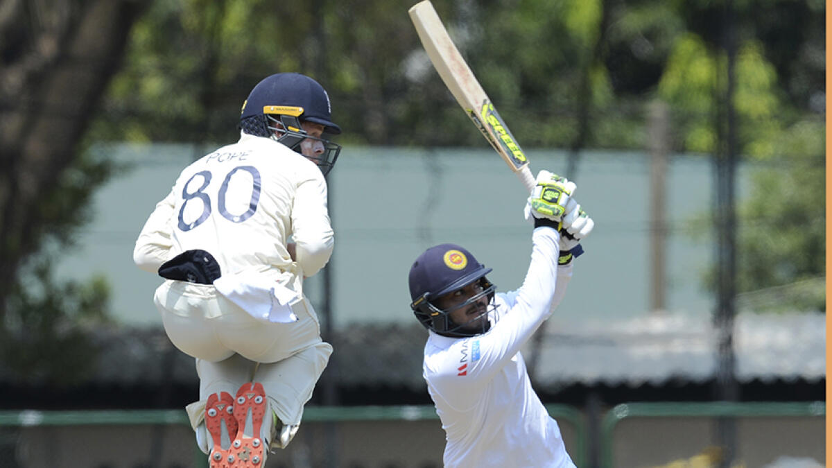 England's Ollie Pope takes evasive action during the second day of a four-day practice match against the Sri Lanka Board President's XI at the P. Sara Oval Cricket Stadium in Colombo on March 13, 2020. -- AFP