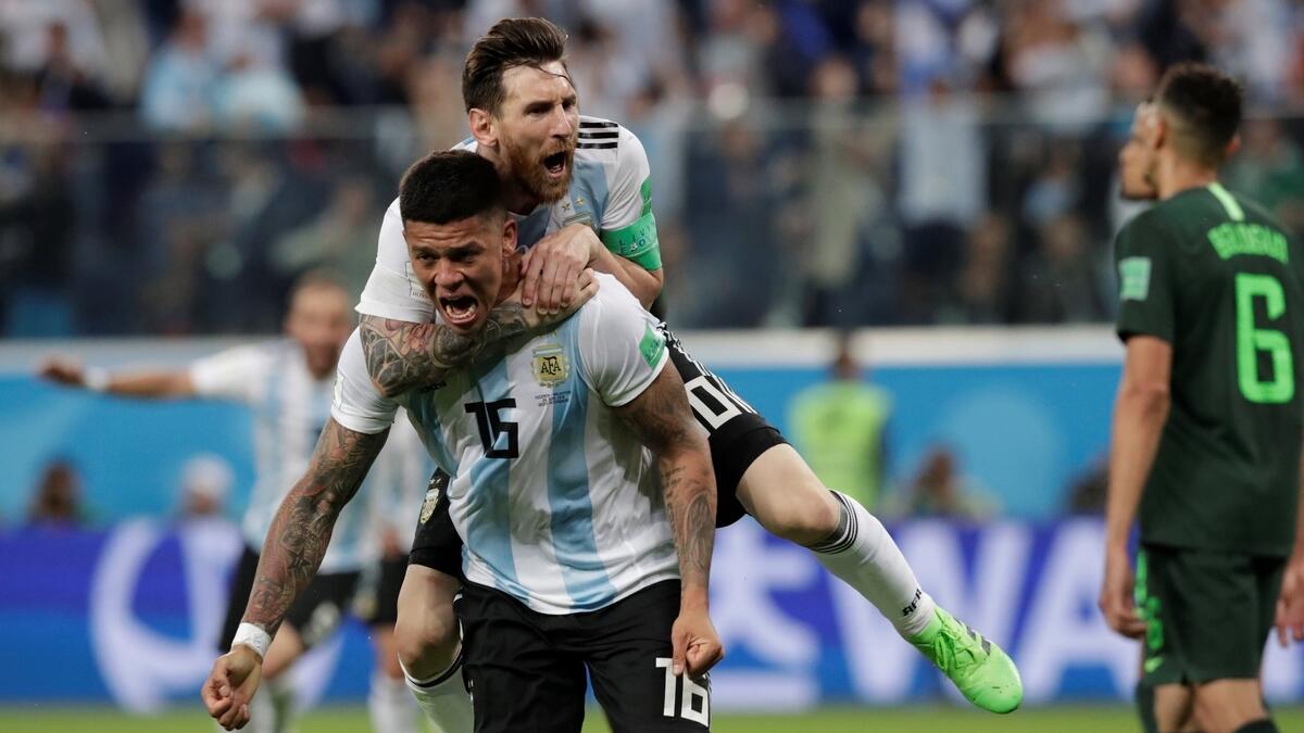 Rojo lifts Messi and Argentina as former champions advance to Round of 16