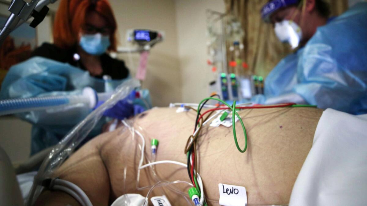 IV lines are labelled with medications for a Covid-19 patient at Providence St. Mary Medical Center in California. — AFP