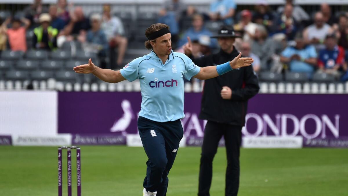 England's Tom Curran celebrates the dismissal of Sri Lanka's Chamika Karunaratna during the third one-day international match against Sri Lanka. — AP
