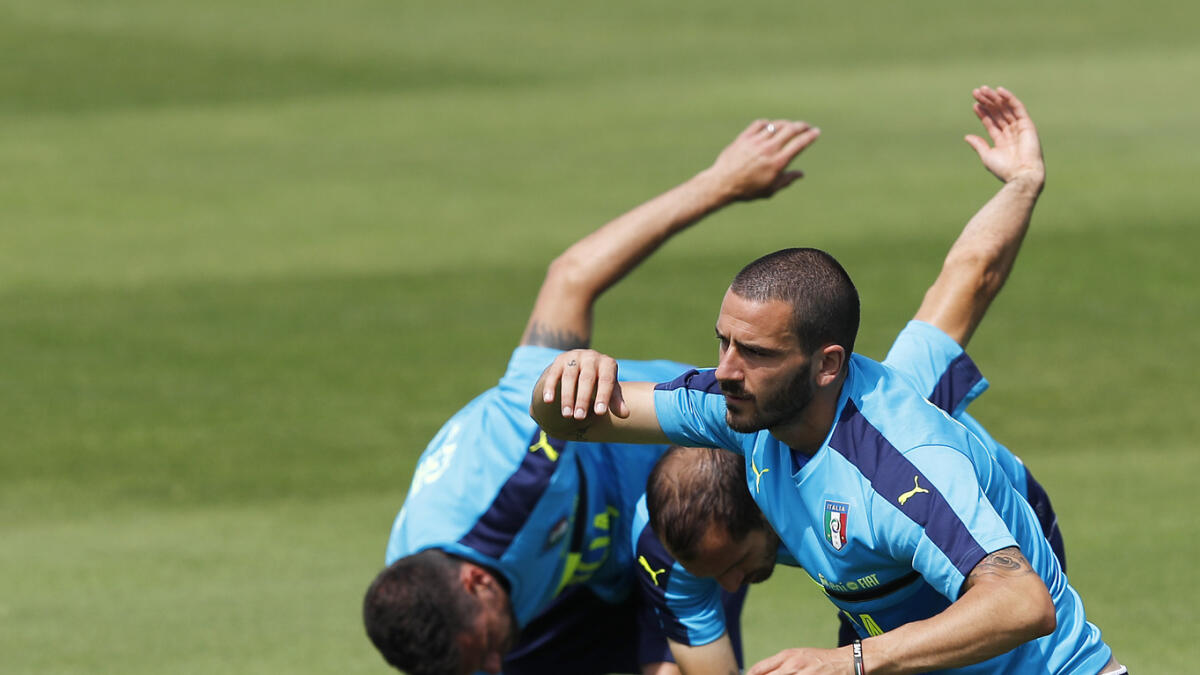 Italy’s Leonardo Bonucci (right) attends a training session with his teammates. — AP