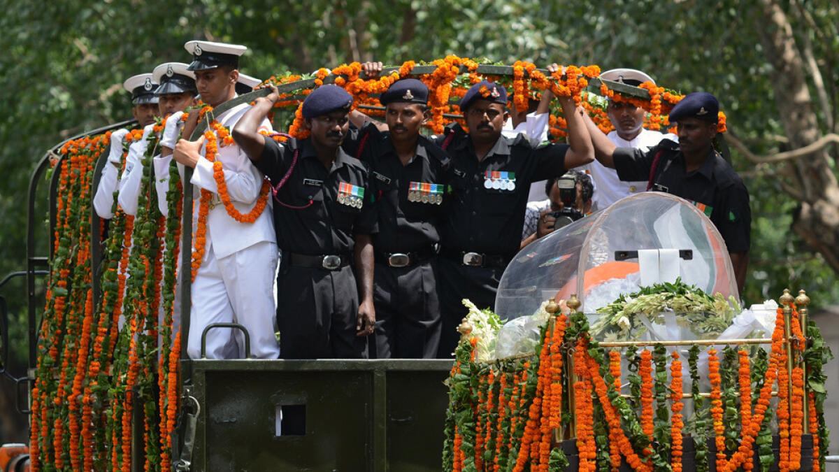 The body of former Indian president A.P.J. Abdul Kalam is transported from the airport to his house in New Delhi.