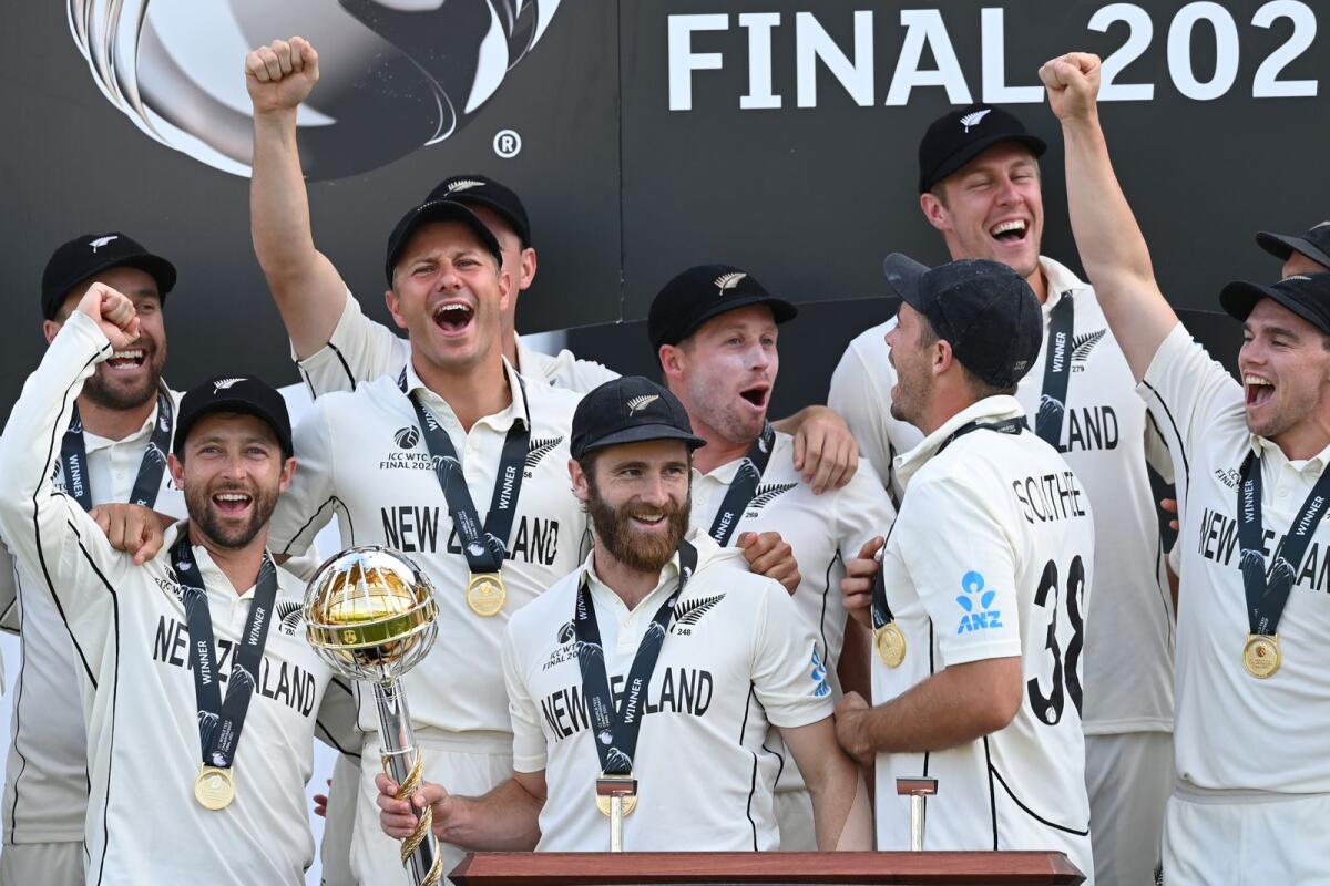 New Zealand's captain Kane Williamson (centre) holds the winners' Mace as New Zealand players celebrate winning the ICC World Test Championship final against India. — AFP file